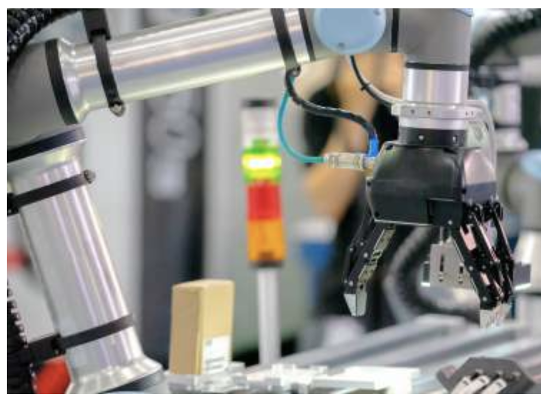 Robotic arm testing a mobile device