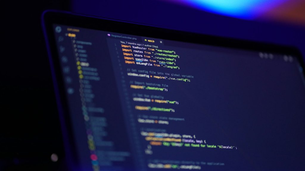 A developer's laptop showing code in an editor