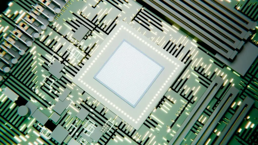 A glowing microchip on a green circuit board
